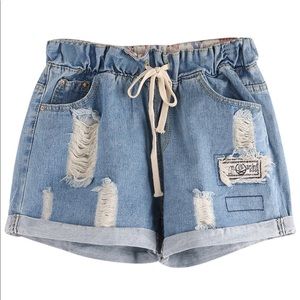 A pair of stretchy jeans shorts.